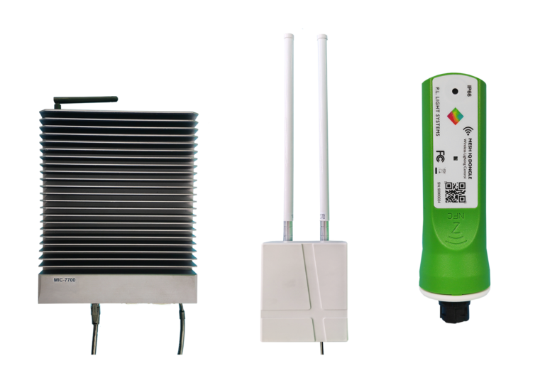 MeshIQ wireless control system components lined up: industrial PC, gateway with antennas, and dongle